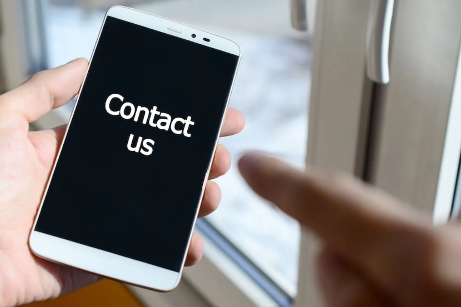 A person reading a private message on a phone screen