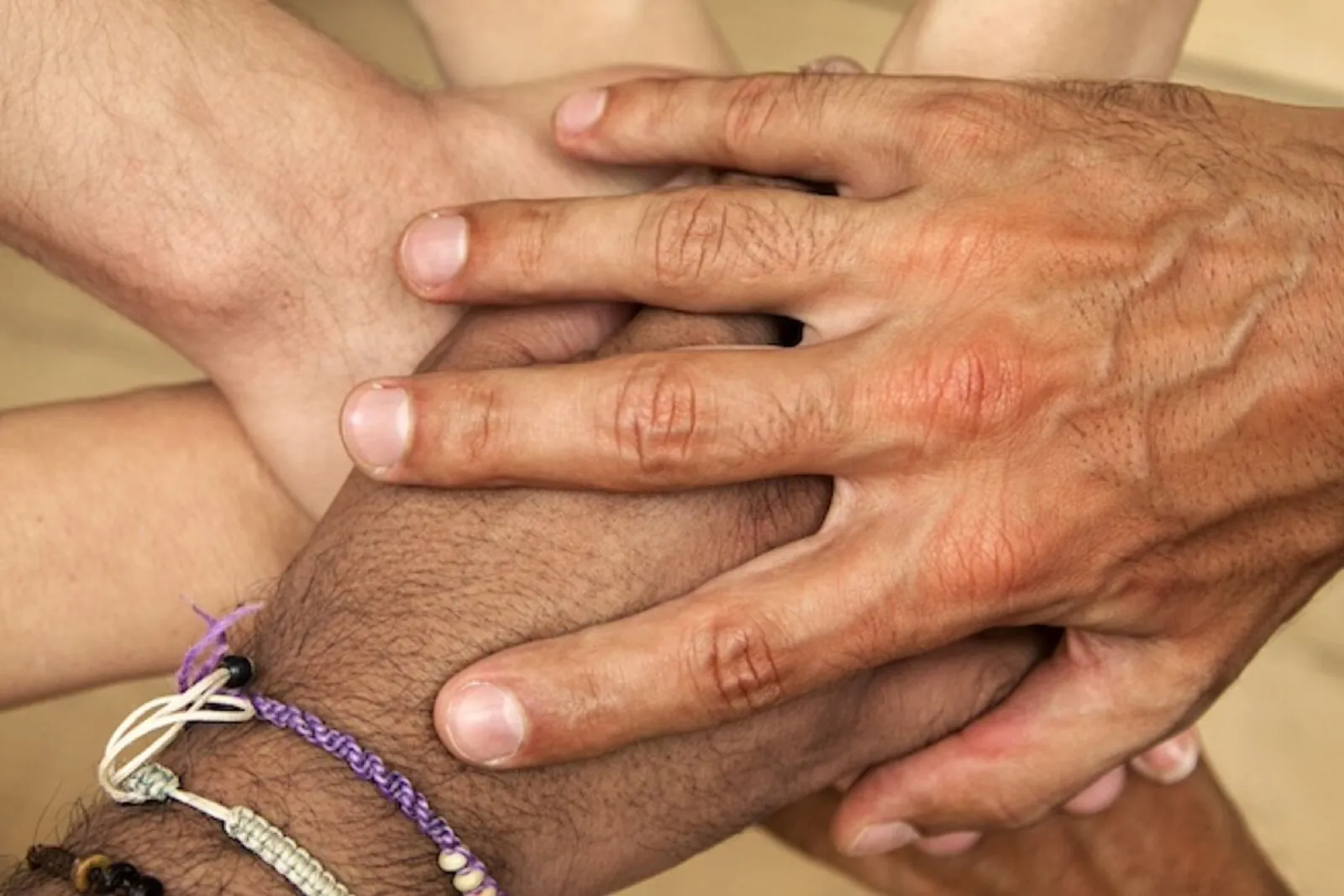 A group of hands joined together